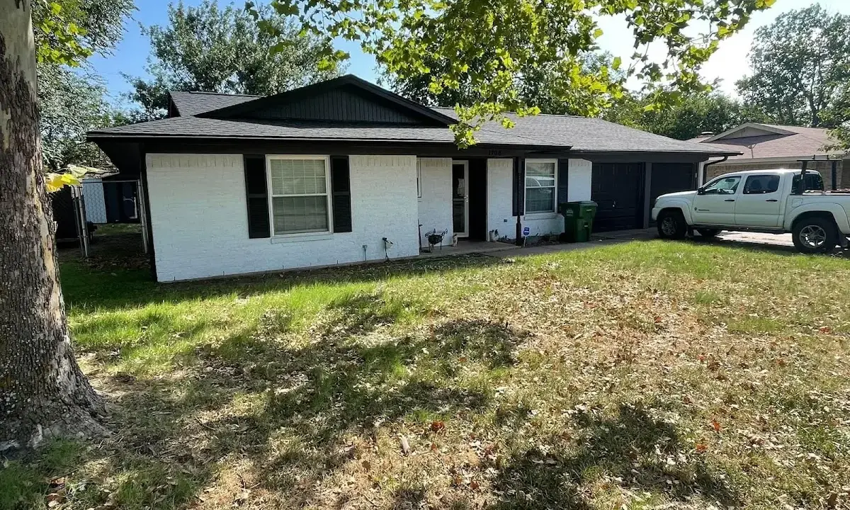 Professional roofing crew working on a residential roof in Montgomery Village